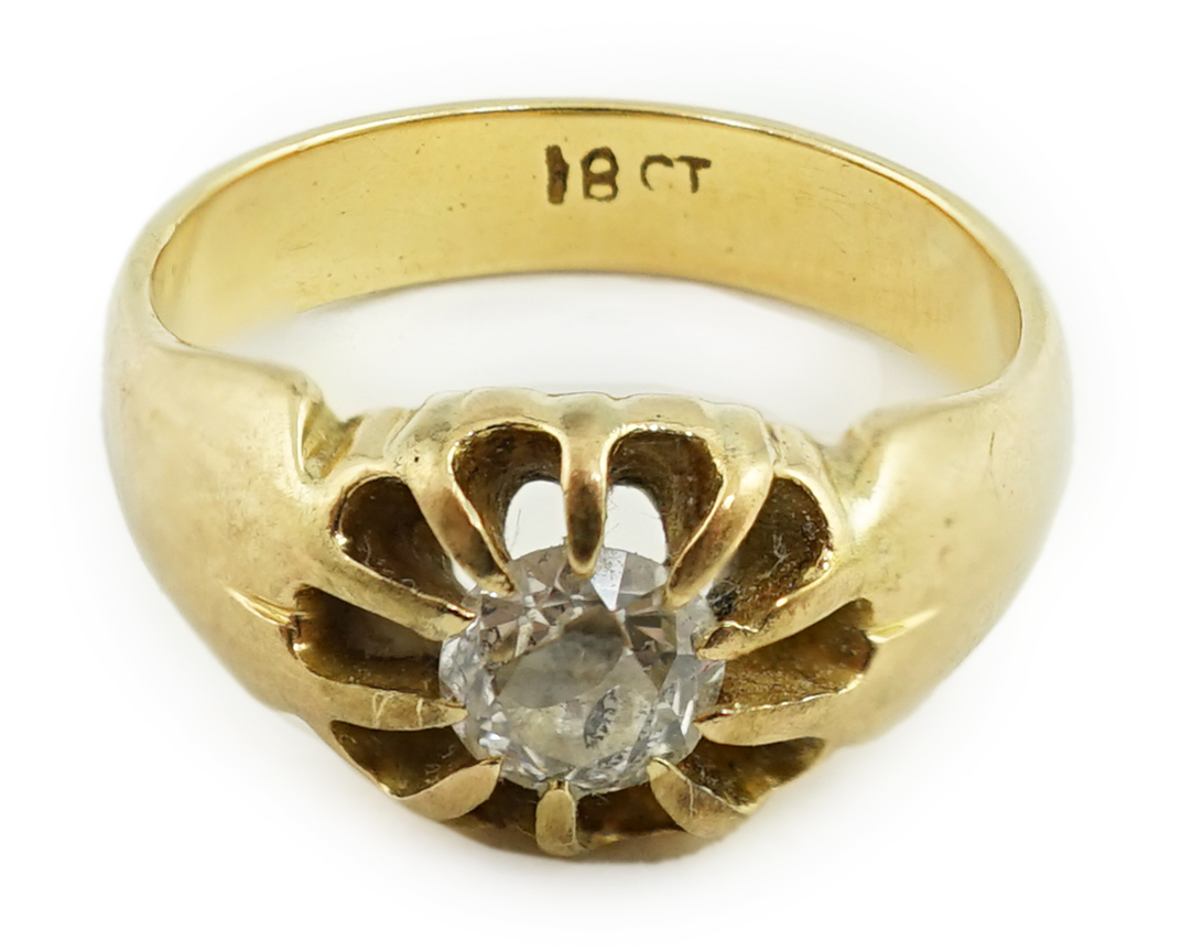 An early 20th century 18ct gold and claw set solitaire diamond ring